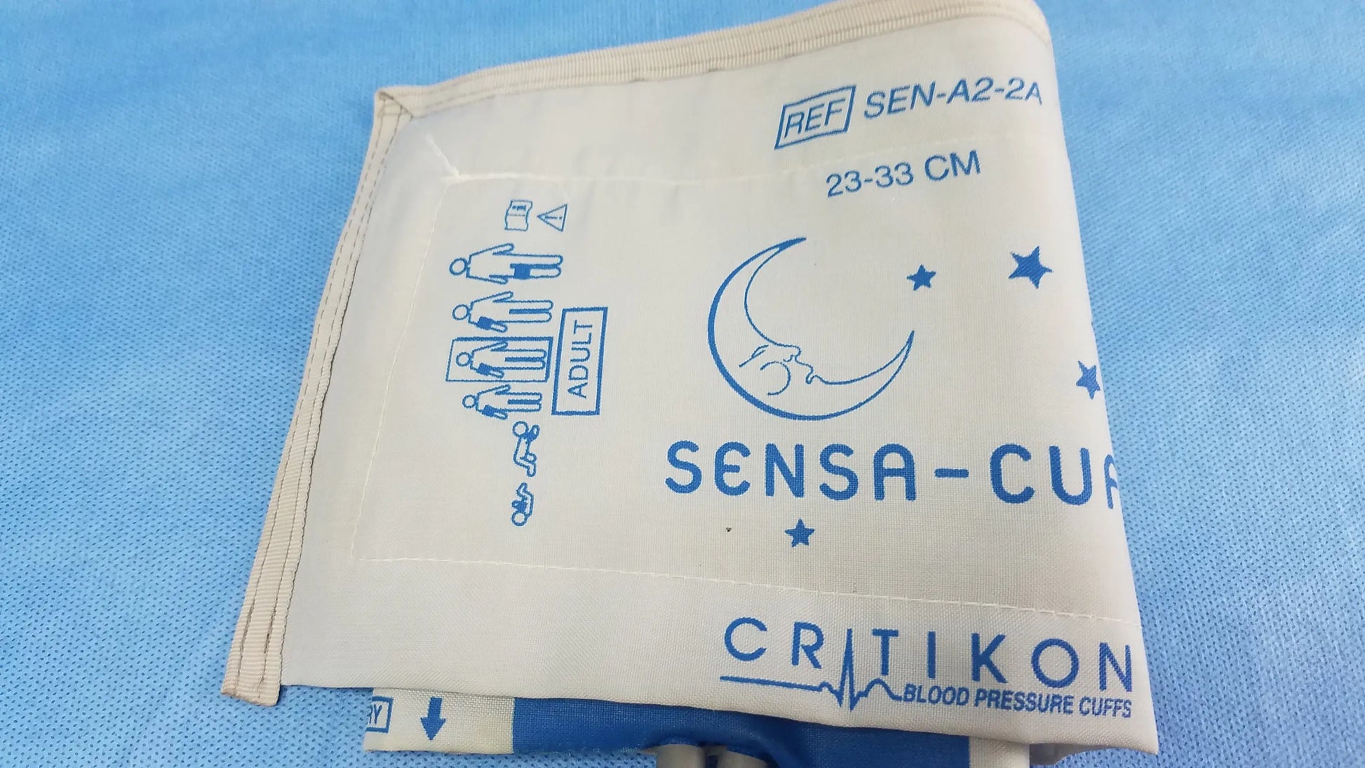 Welch Allyn vital signs monitor 6000 series white fabric blood pressure cuff with blue printed branding and measurement markings