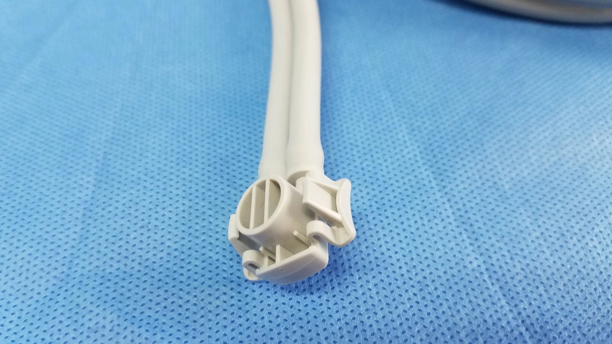 White plastic connector with two attached cables for welch allyn vital signs monitor 6000 series with blood pressure cuffs