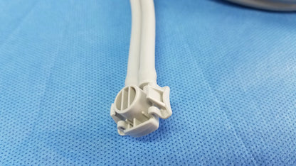 White plastic connector with two attached cables for welch allyn vital signs monitor 6000 series with blood pressure cuffs