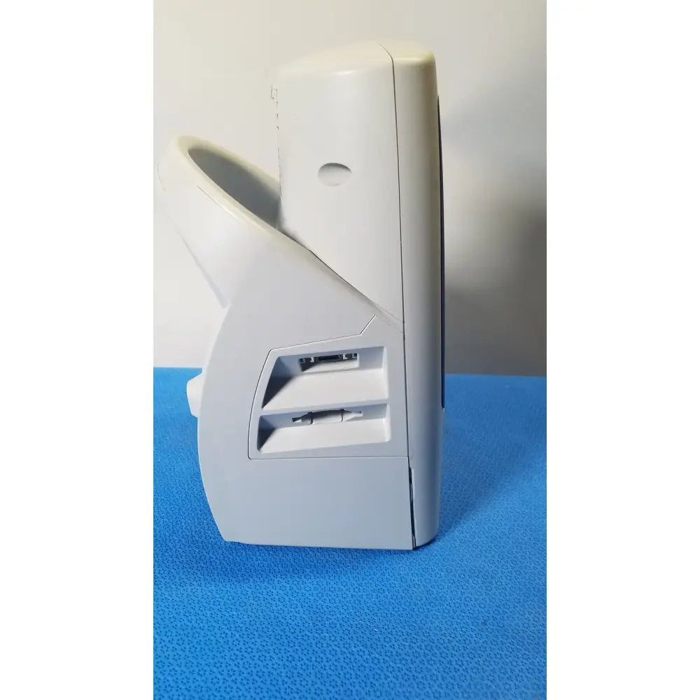 White plastic desktop fan with angular design and intake vents for cooling welch mismo set allyn spot monitor