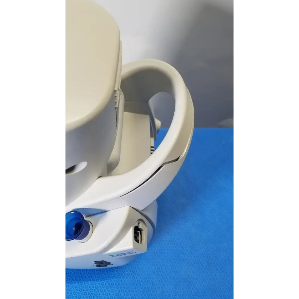 White plastic headgear with blue button and usb port featuring ergonomic design for medical use in mismo set allyn spot