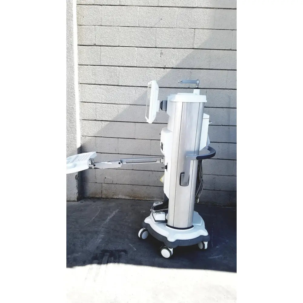 Silver and white medical-grade whitestar signature phacoemulsifier with monitor arm wheels and sleek cylindrical body