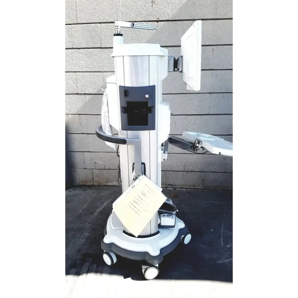 White medical treatment cart with mounted monitor and caster wheels for whitestar signature phacoemulsifier with footswitch