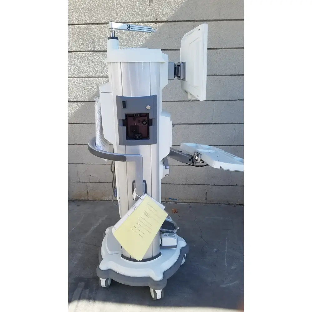 White and gray medical-grade whitestar signature phacoemulsifier with mounted monitor, adjustable arms, and caster wheels