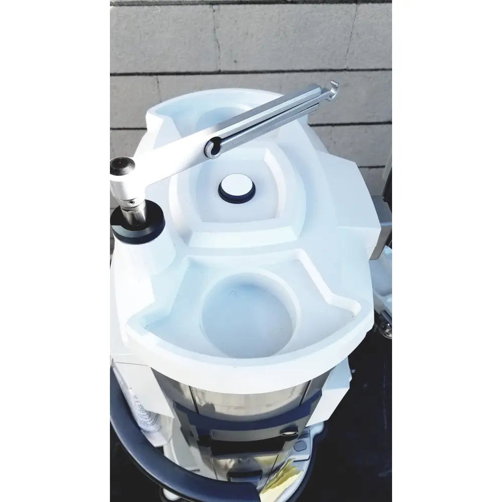 White plastic whitestar signature phacoemulsifier with silver metal handle and black accents featuring footswitch