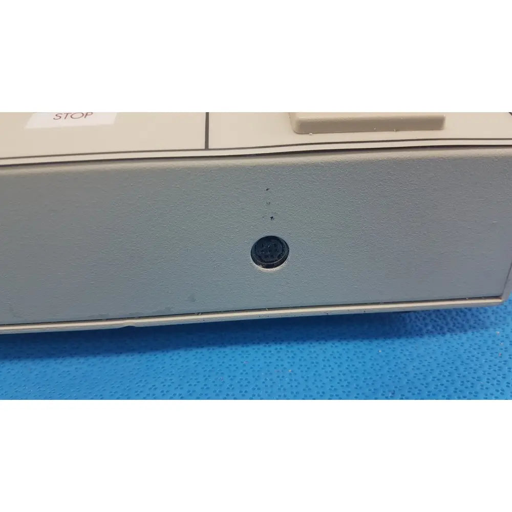 Williams 6100 ultrasound therapeutic device with gray plastic case and black circular port on front panel for clinical use