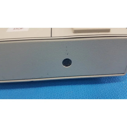 Williams 6100 ultrasound therapeutic device with gray plastic case and black circular port on front panel for clinical use