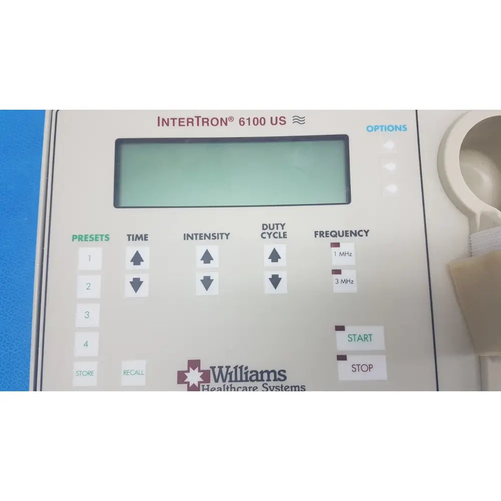 White plastic control panel with digital display and labeled buttons for williams 6100 ultrasound therapeutic device