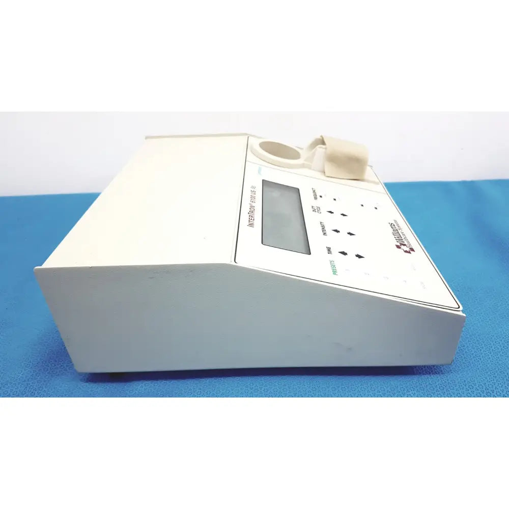 White rectangular ultrasound therapeutic device with digital display and control buttons by integra for clinical use