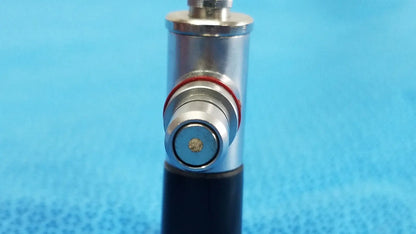 Silver metallic cylindrical arthroscopy endoscope orthopedic device wolf 8471.42 with black base and red rubber ring