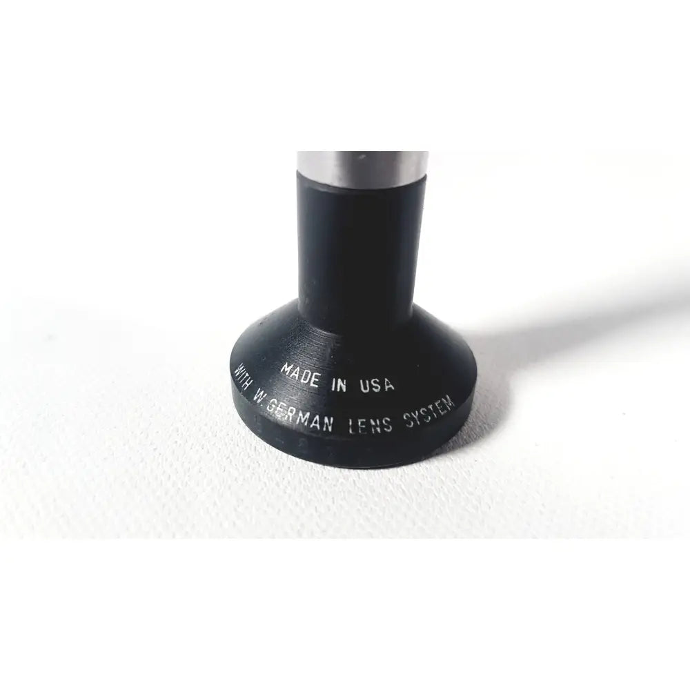 Black cylindrical rigid arthroscope lens adapter with silver metal top engraved made in usa for wolf 8853.42 25 degree rigid arthroscope