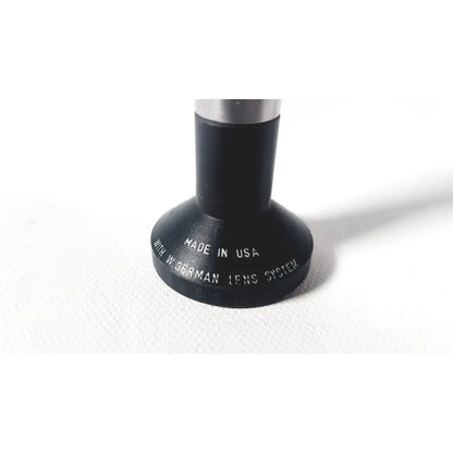 Black cylindrical rigid arthroscope lens adapter with silver metal top engraved made in usa for wolf 8853.42 25 degree rigid arthroscope
