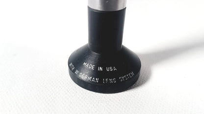 Black cylindrical rigid arthroscope lens adapter with silver metal top engraved made in usa for wolf 8853.42 25 degree rigid arthroscope