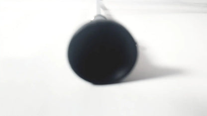 Black cylindrical mug with glossy finish hanging by handle shown with wolf 8853.42 25 degree rigid arthroscope product