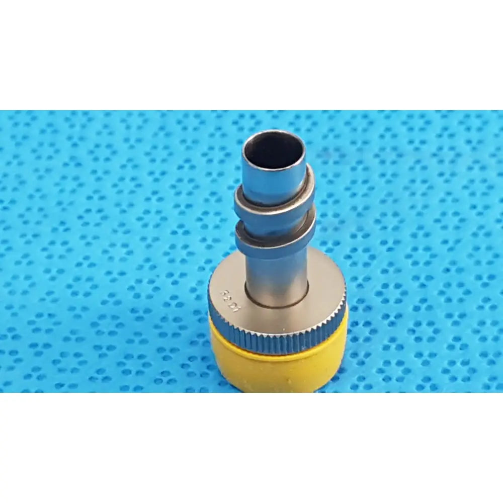 Wolf stainless luer-lock tube connector in yellow and silver with textured grip ring for surgical instrument fitting