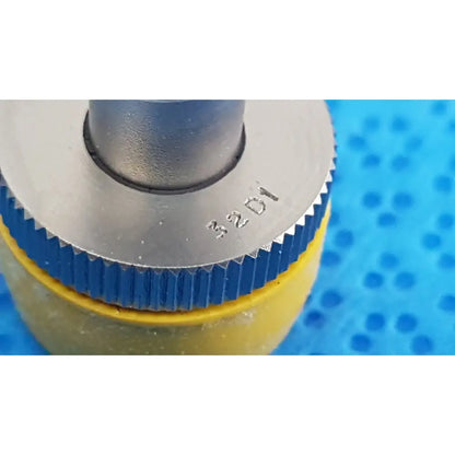 Wolf stainless luer-lock tube connector featuring silver metallic cylinder with blue ribbed collar and yellow base marked 32d1