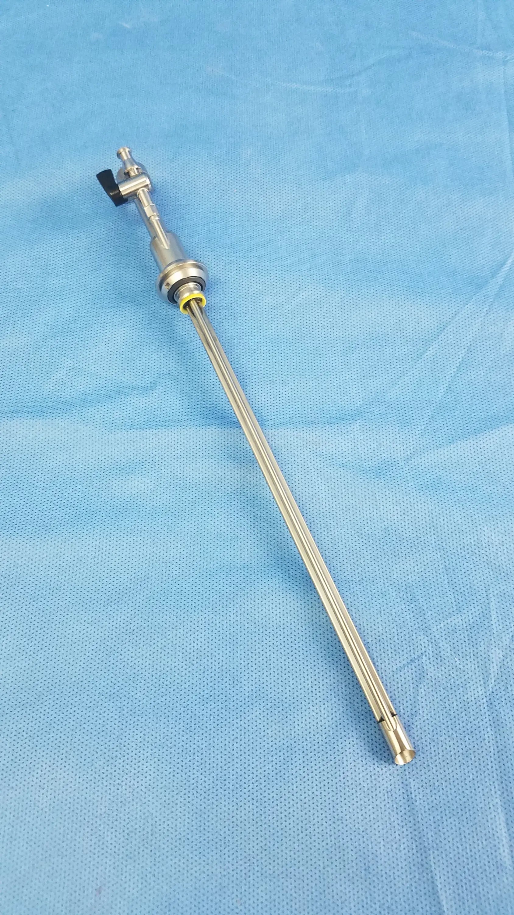 Silver working insert hystero-resectoscope with black articulated head and olympus sterilization tray endoscopic instrument