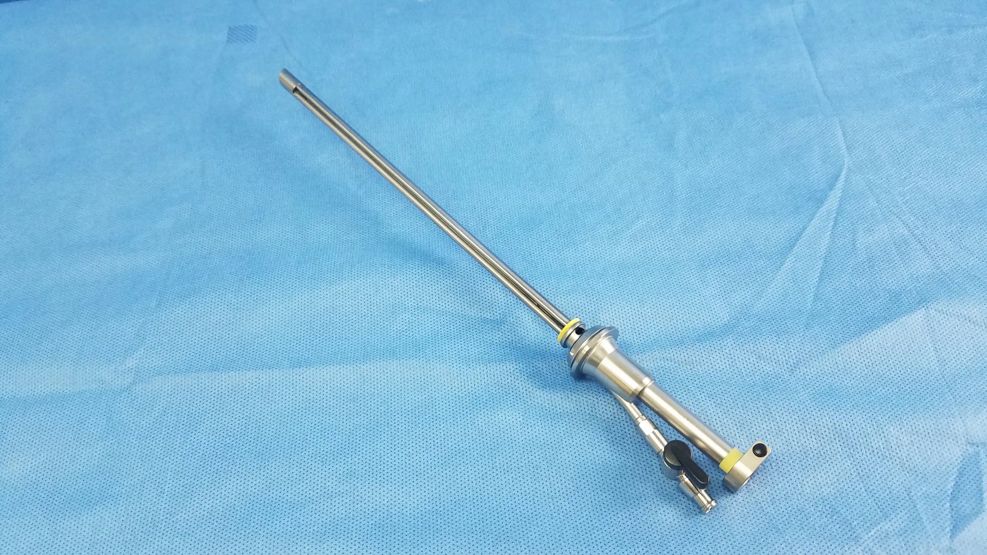 Silver working insert endoscopic instrument with long metallic shaft and articulated joints in olympus sterilization tray