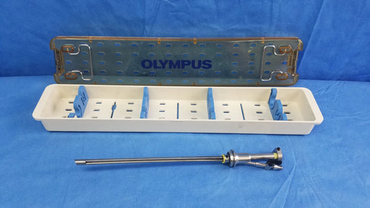 Working insert hystero-resectoscope with olympus sterilization tray and metallic endoscopic instrument on table