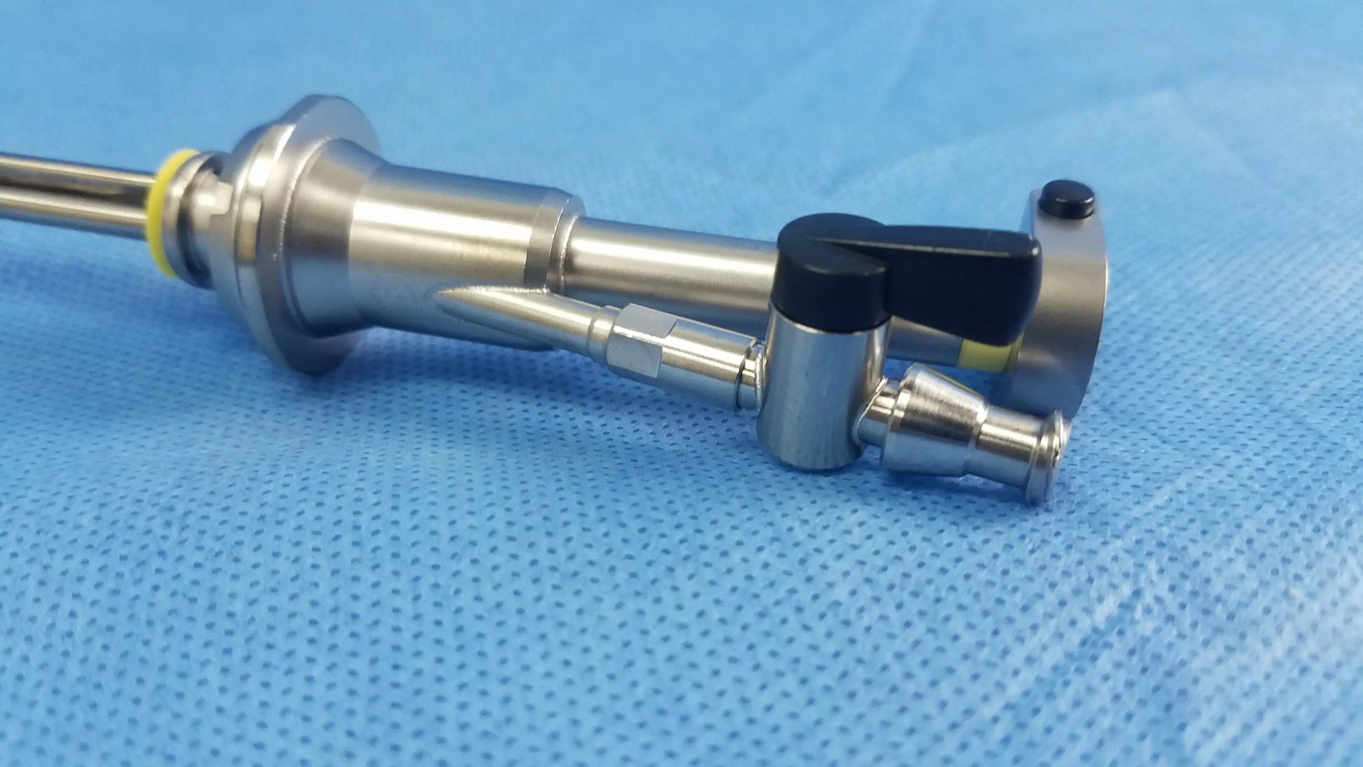 Stainless steel working insert hystero-resectoscope with black handle yellow accent in olympus sterilization tray endoscopic instrument