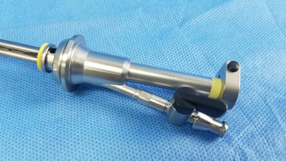 Silver working insert endoscopic instrument with black and yellow accents in olympus sterilization tray for hystero resectoscope