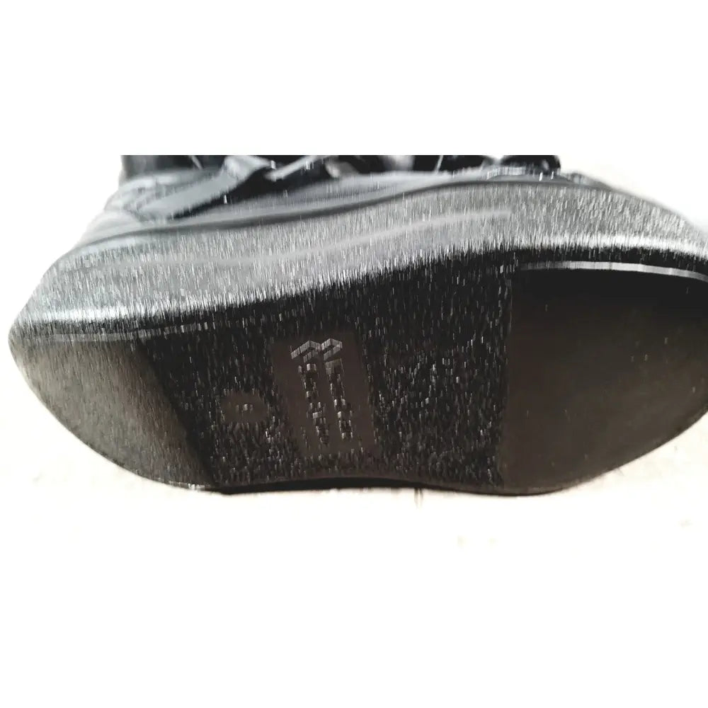 Small black textured sole with subtle sheen and embossed logo for wound care shoe system care shoe