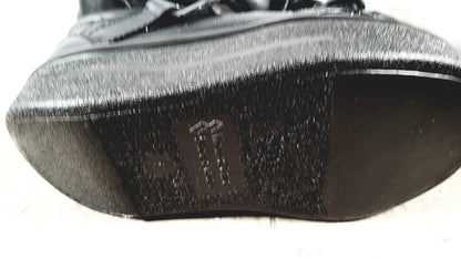 Small black textured sole with subtle sheen and embossed logo for wound care shoe system care shoe