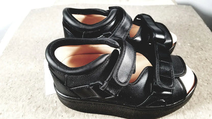 Black leather wound care shoe with adjustable velcro straps and thick supportive sole for small size care shoe system