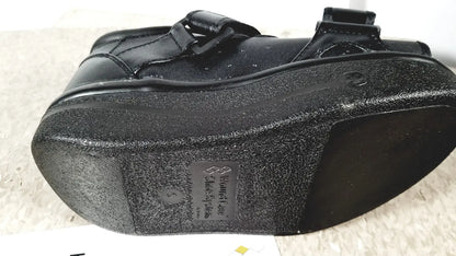 Black wound care shoe system small with textured rubber sole and adjustable strap closure for reuse medical use