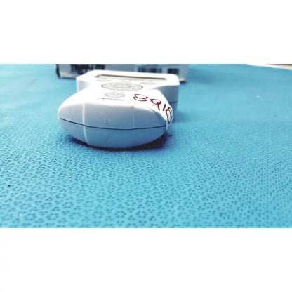 White plastic handheld glucose meter with digital display and circular buttons by biologic for xavant technology stimpod nms use