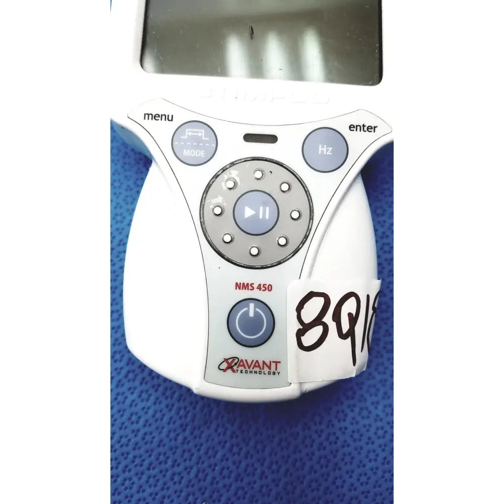 White plastic xavant technology stimpod nms 450 device with circular control pad and labeled buttons for transmission monitoring