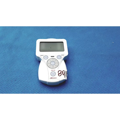 White plastic handheld device with screen and circular button pad labeled rivant model nms 450 for xavant technology stimpod transmission monitoring