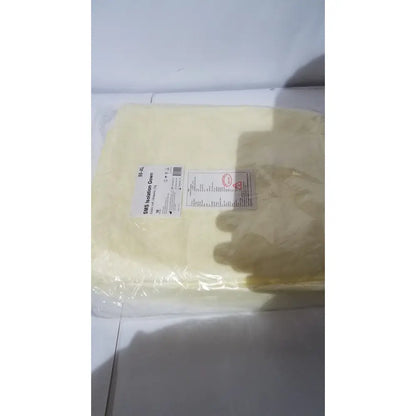 A pale yellow xiantao 55-xl sms isolation gown in size xl with 6mm thickness and elastic cuff for medical use