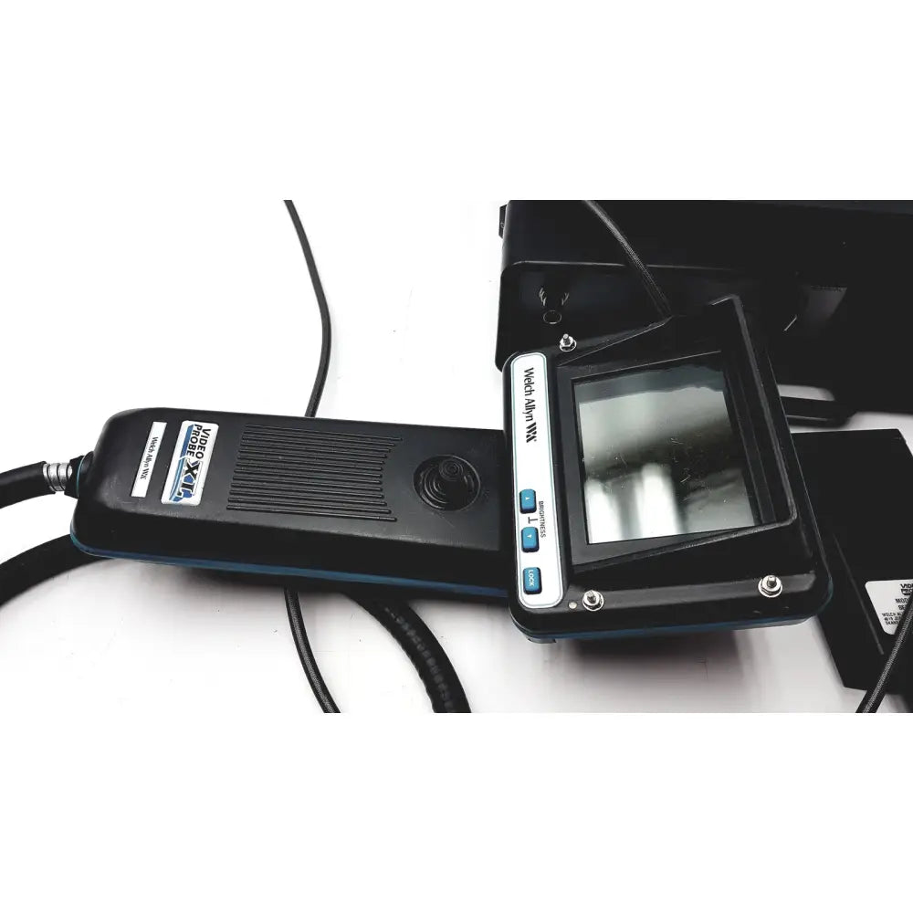 Black and silver handheld xl240lsa video probe with small screen labeled videotek for inspection use