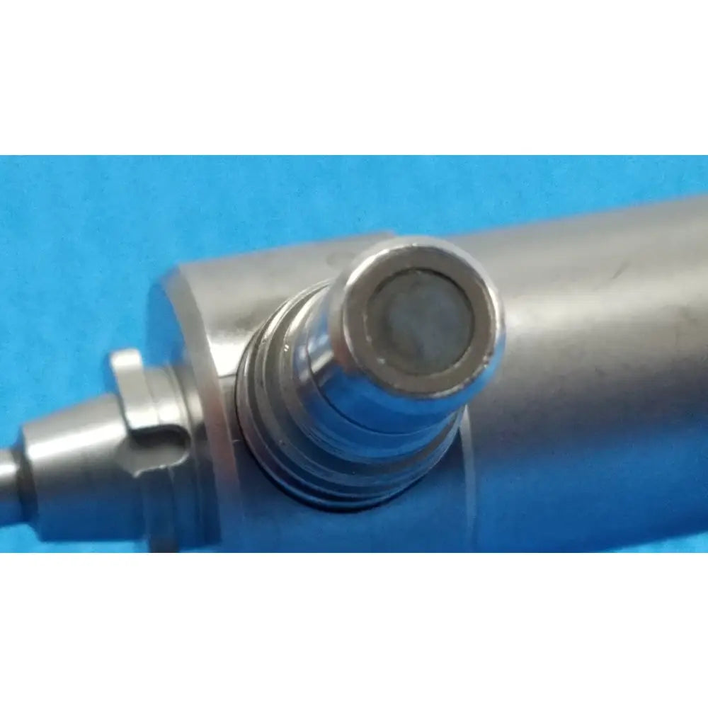 Silver metallic cylindrical component with threaded connection and circular end cap for xomed sharpsite 30° autoclavable endoscope