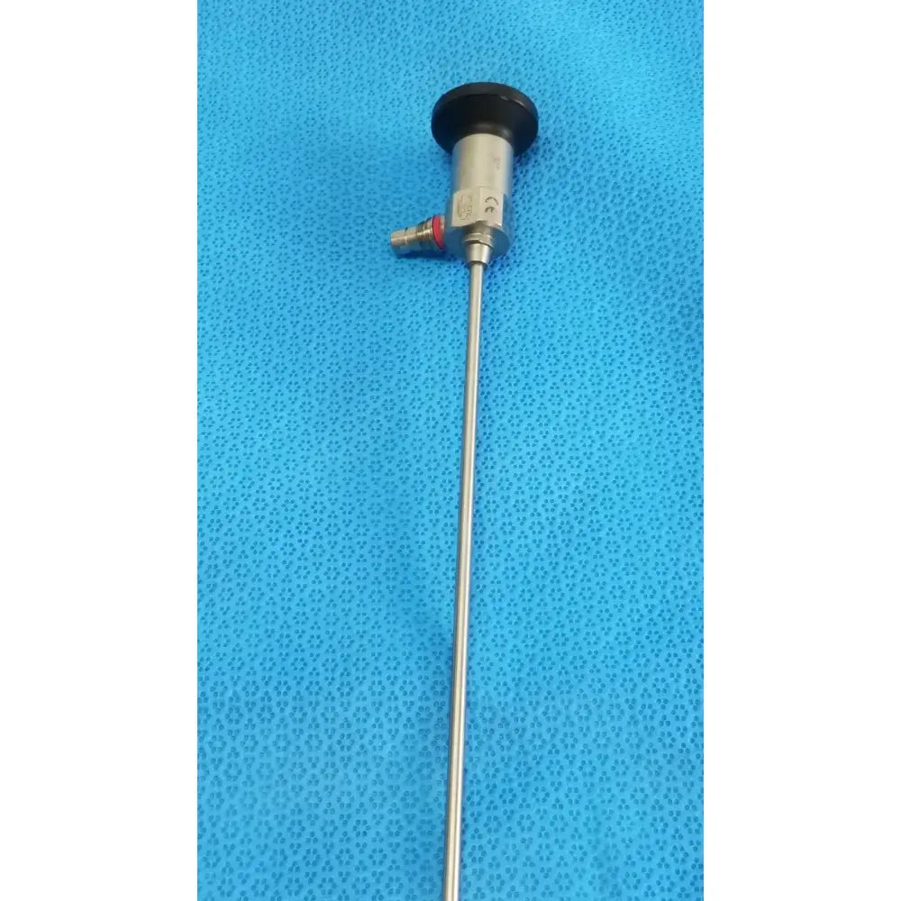 Silver xomed sharpsite autoclavable endoscope with black circular cap and metallic joints for reuse medical applications