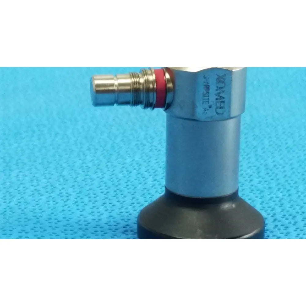 Silver metallic medical valve with brass connector and red o-ring branded ximed for xomed sharpsite autoclavable endoscope reuse medical