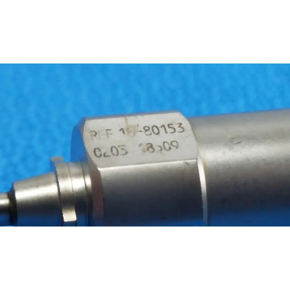Silver metallic cylindrical component of xomed sharpsite 30° autoclavable endoscope with engraved reference and date markings