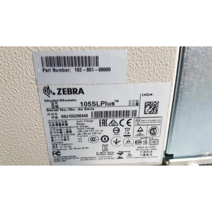 Zebra 105sl plus usb ethernet thermal transfer label printer with black text barcode label showing model and serial info