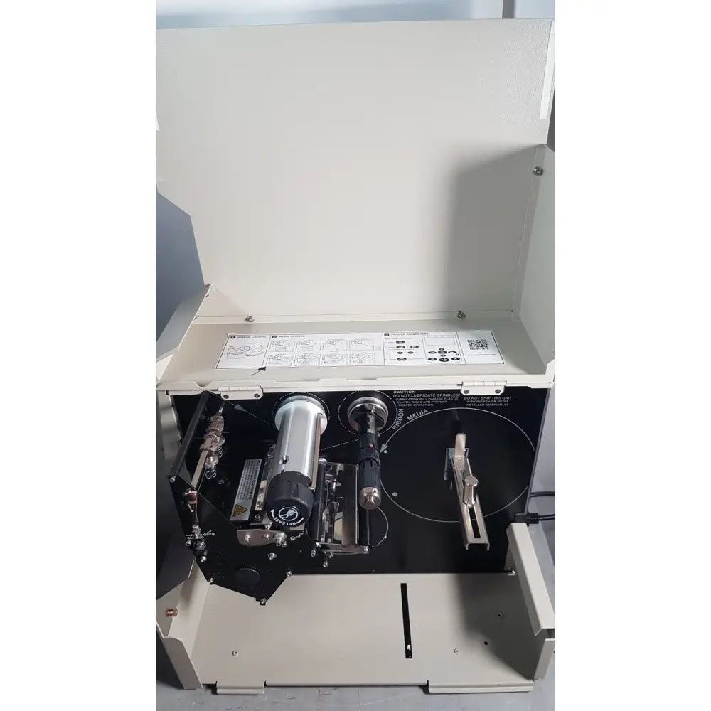 Industrial-grade zebra 105sl plus USB ethernet label printer with metallic cylindrical print head and beige casing