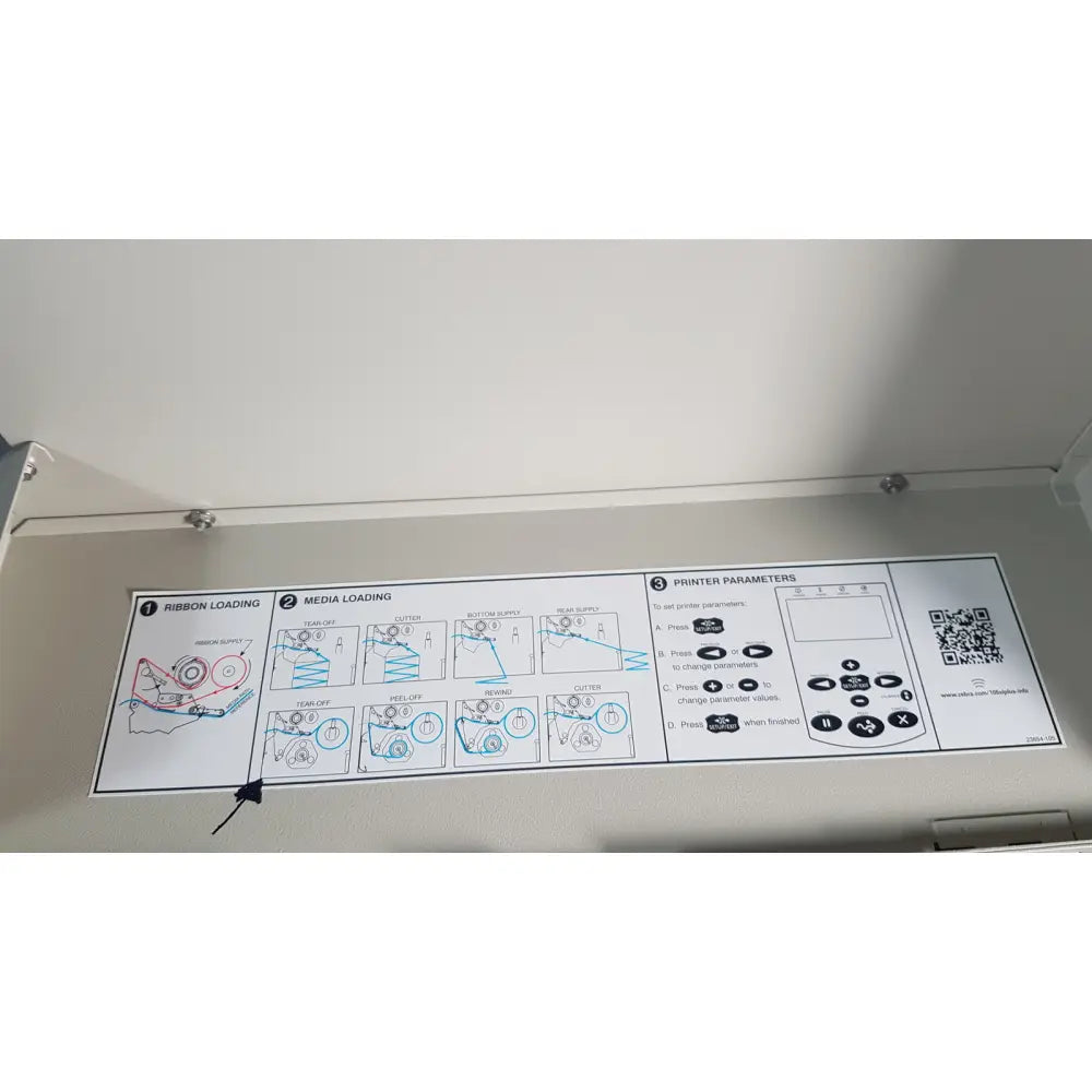 Instruction manual with illustrated steps and qr code for ribbon and media loading and setup of zebra 105sl plus usb printer