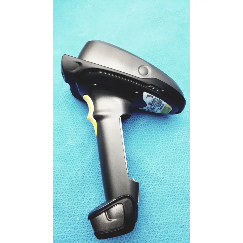 Image of the back side of a black and yellow zebra barcode scanner mt2070-sd4d62370wr with battery charger