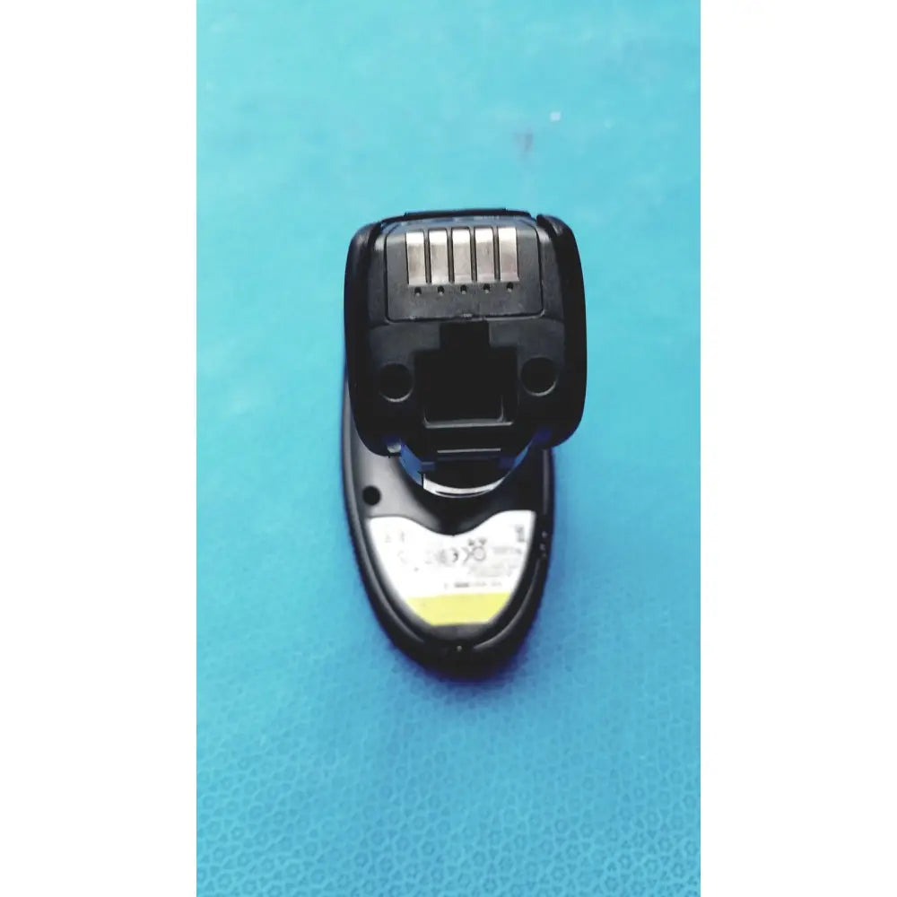 Black plastic battery pack with silver contact strip and white label for zebra barcode scanner mt2070-sd4d62370wr charger