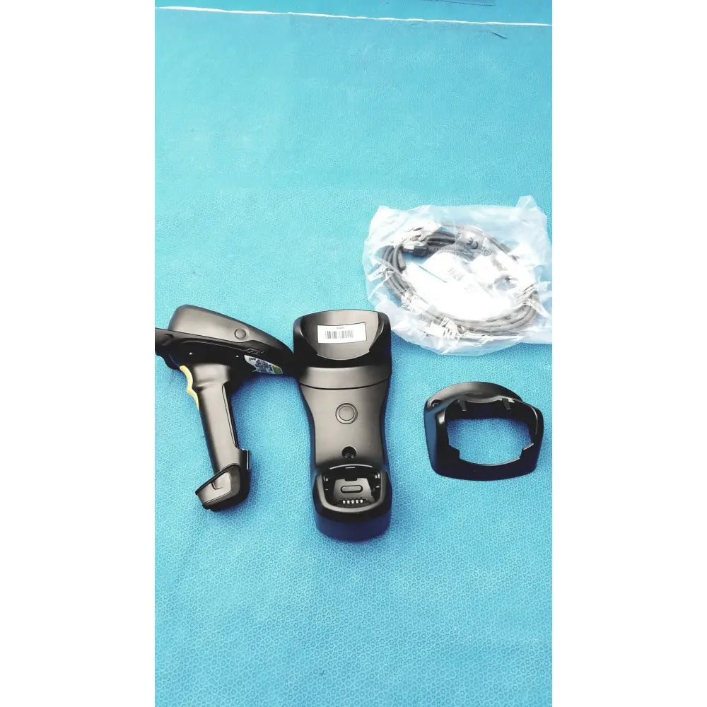 Black zebra barcode scanner mt2070-sd4d62370wr with ergonomic grip trigger charging base and wrist strap for handheld use