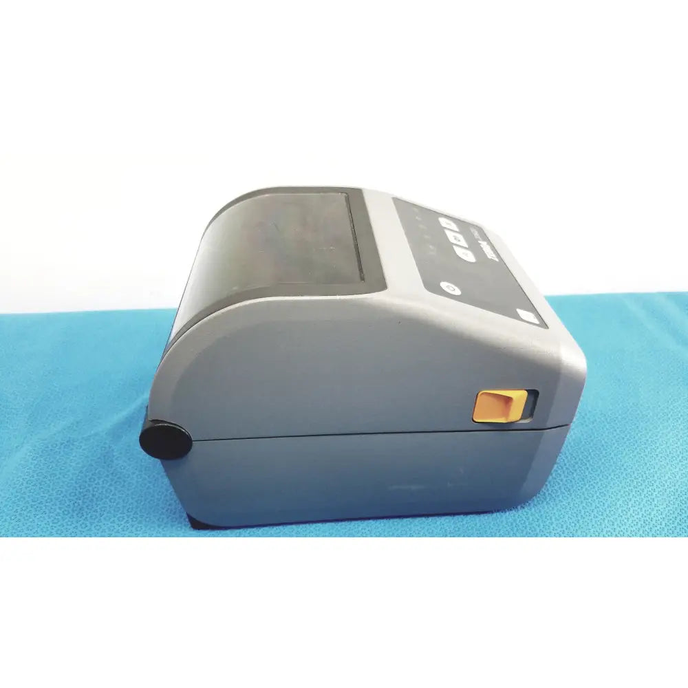 Gray zebra zd620 thermal transfer desktop label printer with black control panel and orange power button