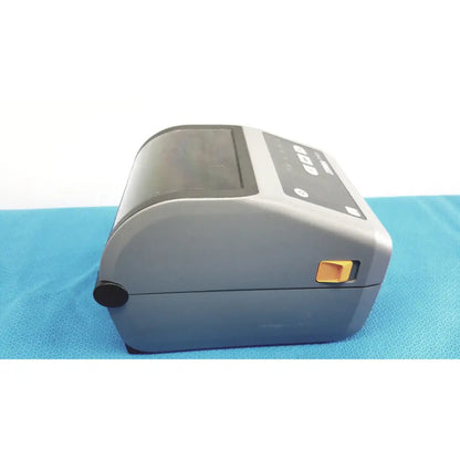 Gray zebra zd620 thermal transfer desktop label printer with black control panel and orange power button