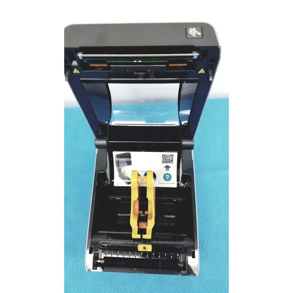 Zebra zd620 thermal transfer desktop label printer in black and blue with yellow paper guide for precise printing