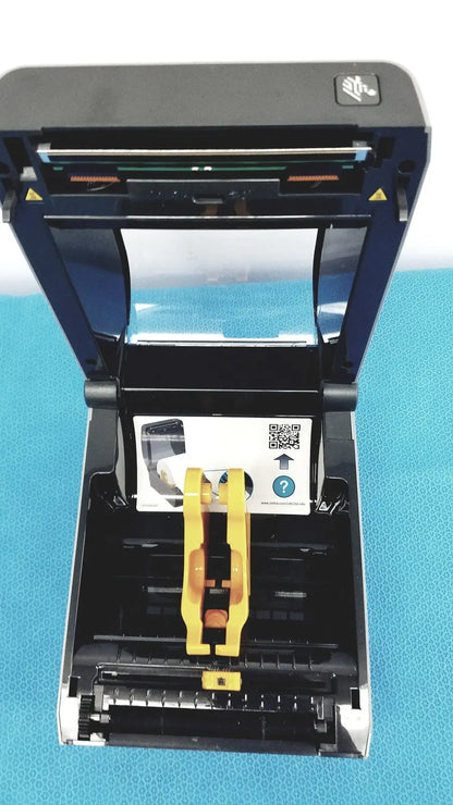 Zebra zd620 thermal transfer desktop label printer in black and blue with yellow paper guide for precise printing
