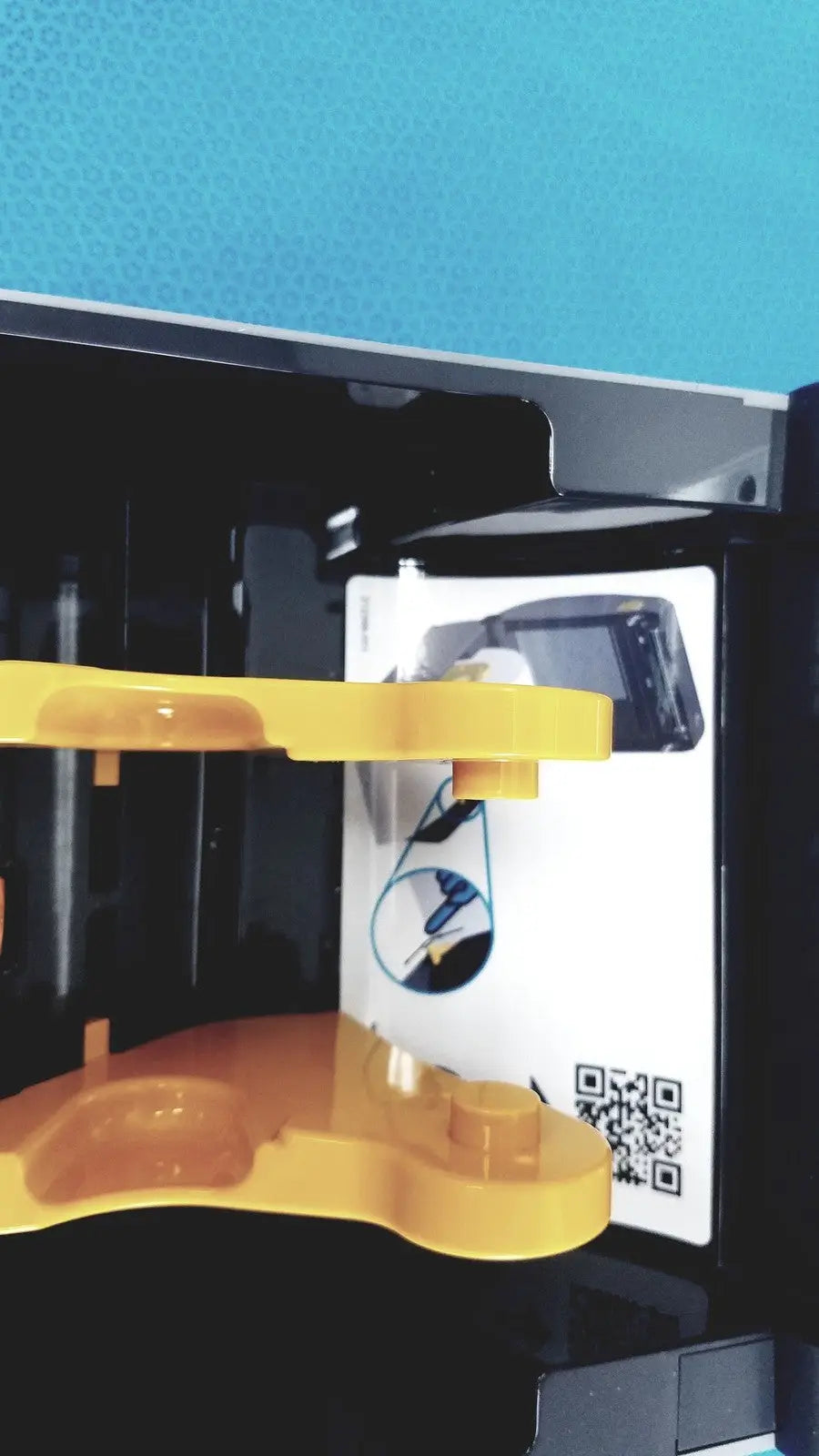Yellow plastic component with curved multi-level design and mounting points for zebra zd620 thermal transfer printer