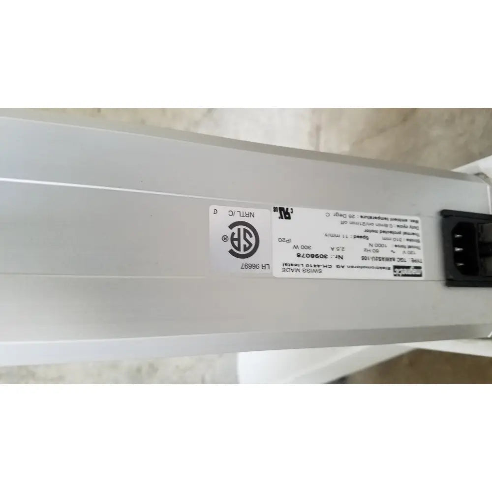 White rectangular led light fixture with label and power connector on back side of zeiss humphrey visual field analyzer model 740